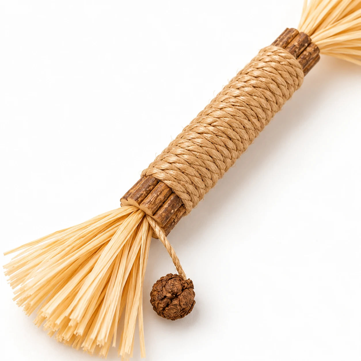 Close-up of the Chauwy silvervine stick with rope, wood and tassel.
